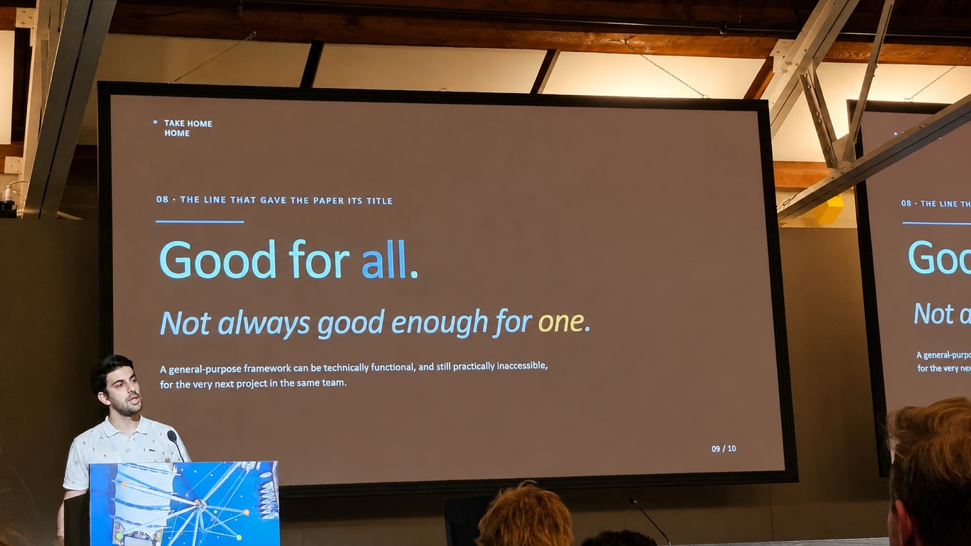 Ashkan Pirmani presenting at a lectern. The slide behind him reads: Good for
                    all. Not always good enough for one. A general purpose framework can be
                    technically functional, and still practically inaccessible, for the very next
                    project in the same team.